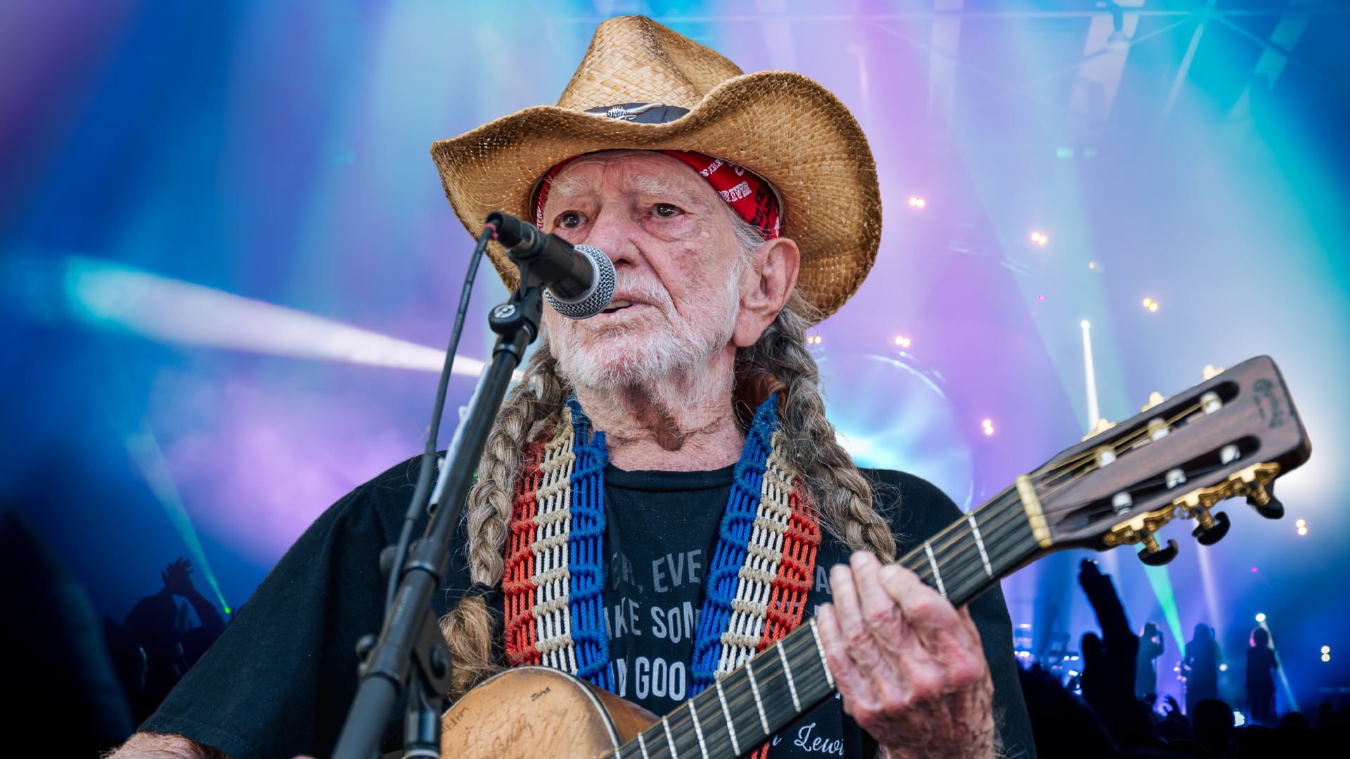 Willie Nelson playing guitar