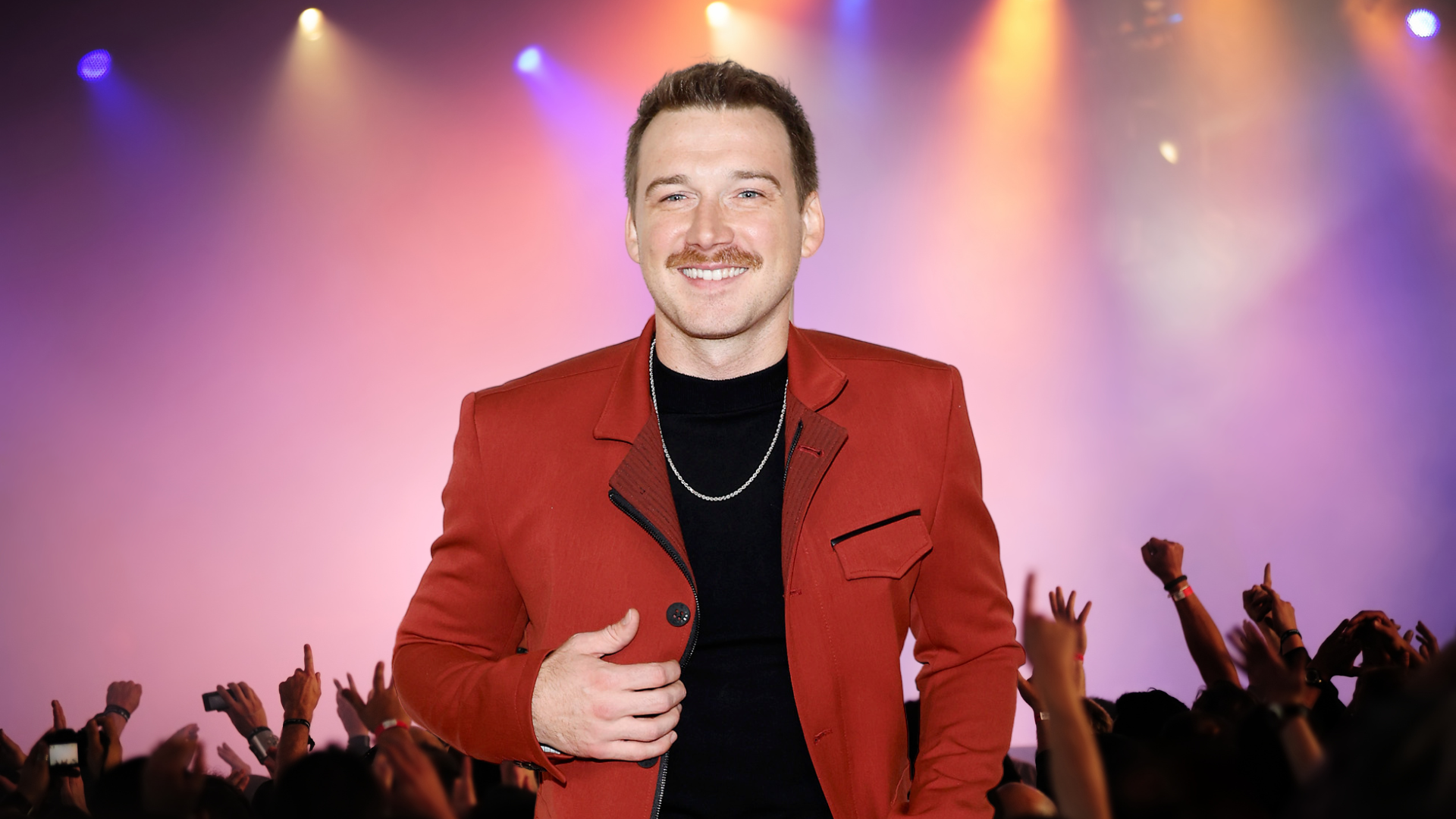 Morgan Wallen posing in front of a crowd