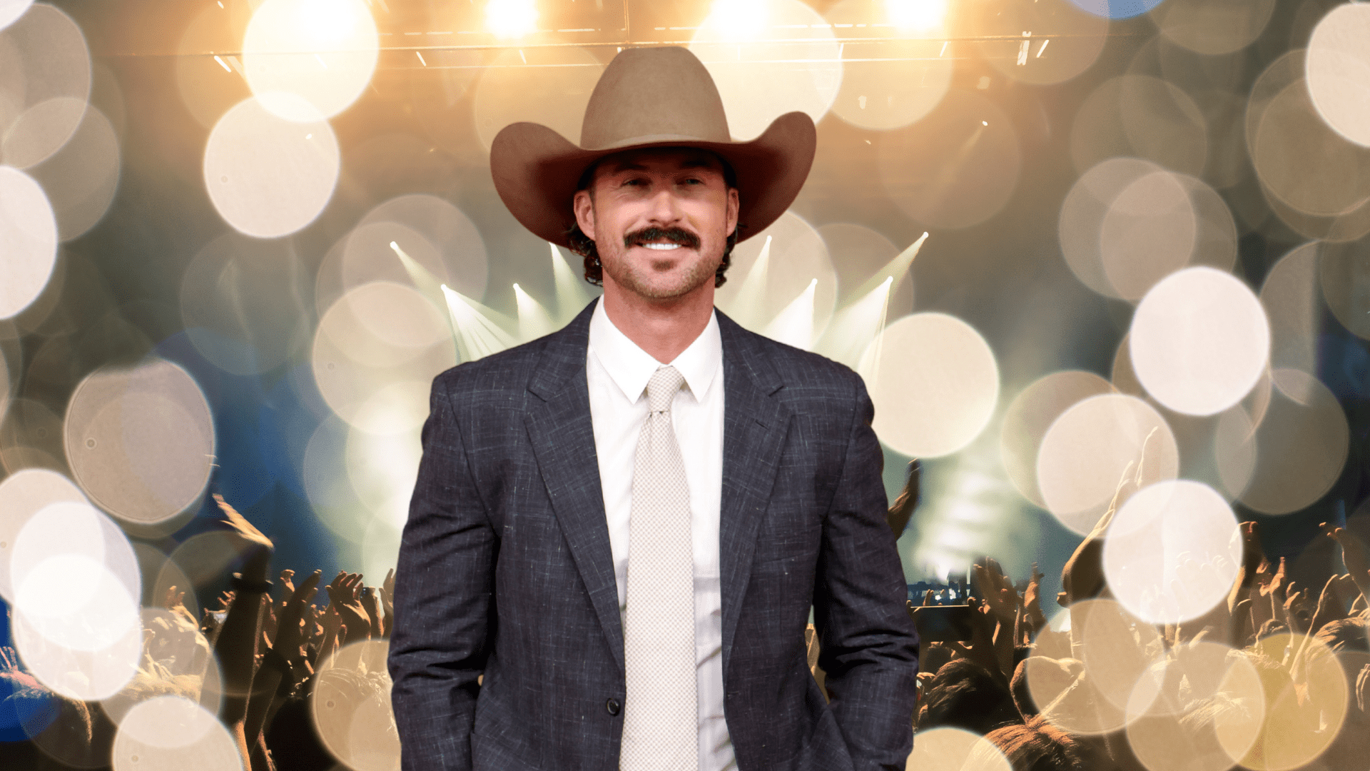 Riley Green smiling in a cowboy hat