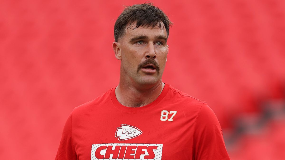 Travis Kelce #87 of the Kansas City Chiefs walks on the field in pregame warmups prior to a preseason game against the Chicago Bears at GEHA Field at Arrowhead Stadium on August 22, 2024