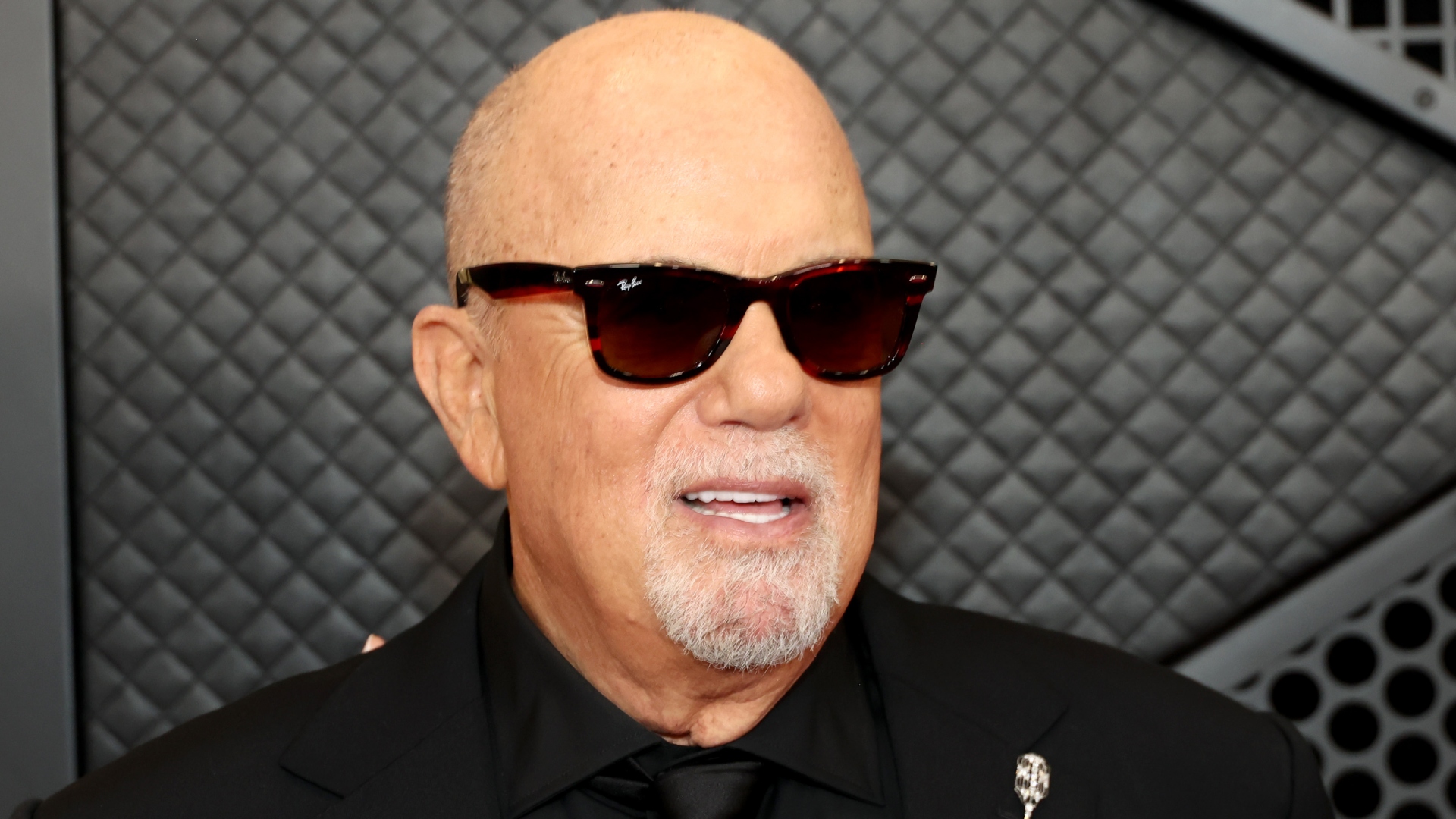 Billy Joel wearing sunglasses at event