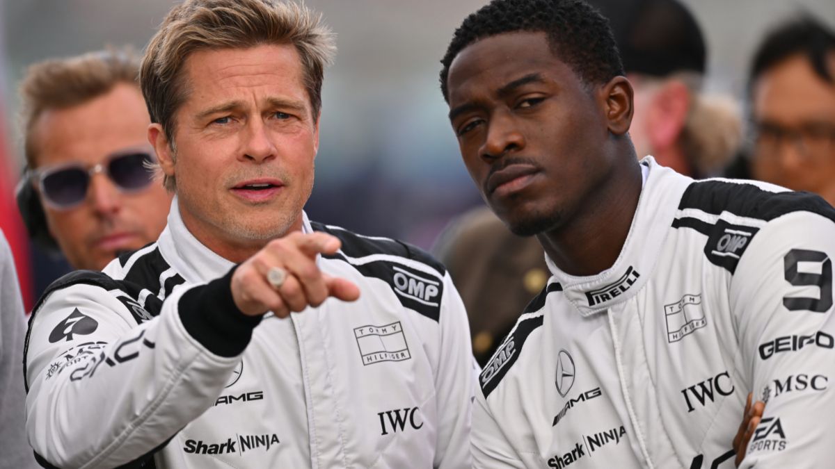 Brad Pitt, star of the upcoming Formula One based movie, Apex, and Damson Idris, co-star of the upcoming Formula One based movie, Apex, look on from the grid during the F1 Grand Prix of Great Britain