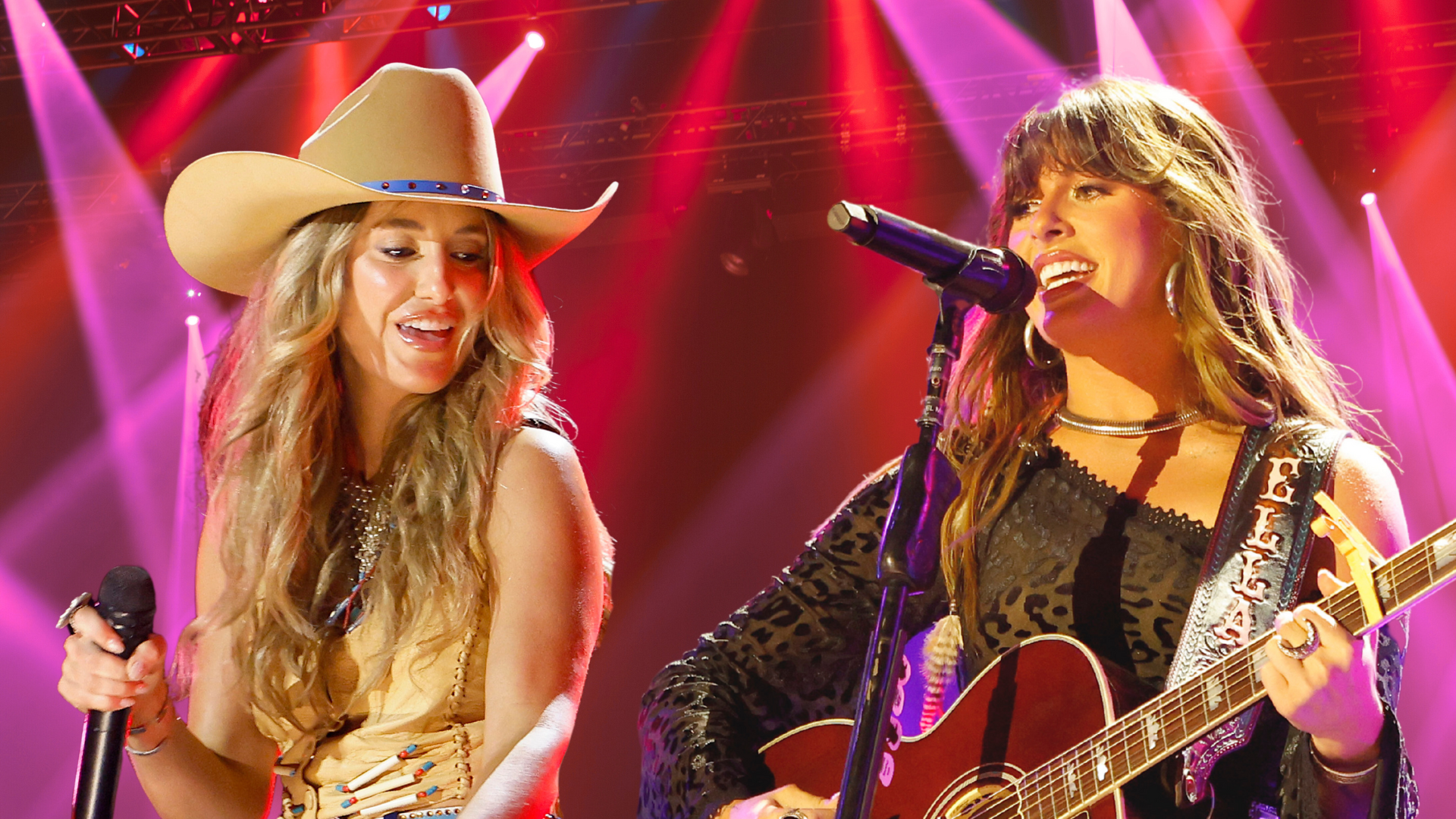 Lainey Wilson and Ella Langley performing on stage