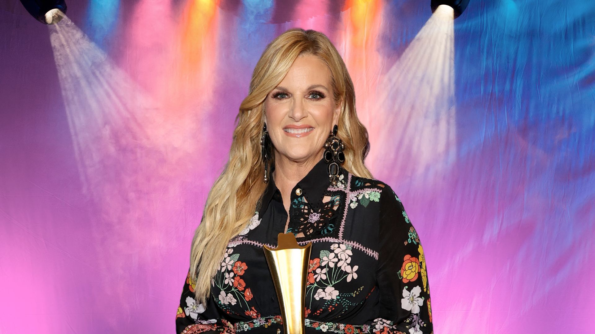 Trisha Yearwood smiling in a colorful jacket