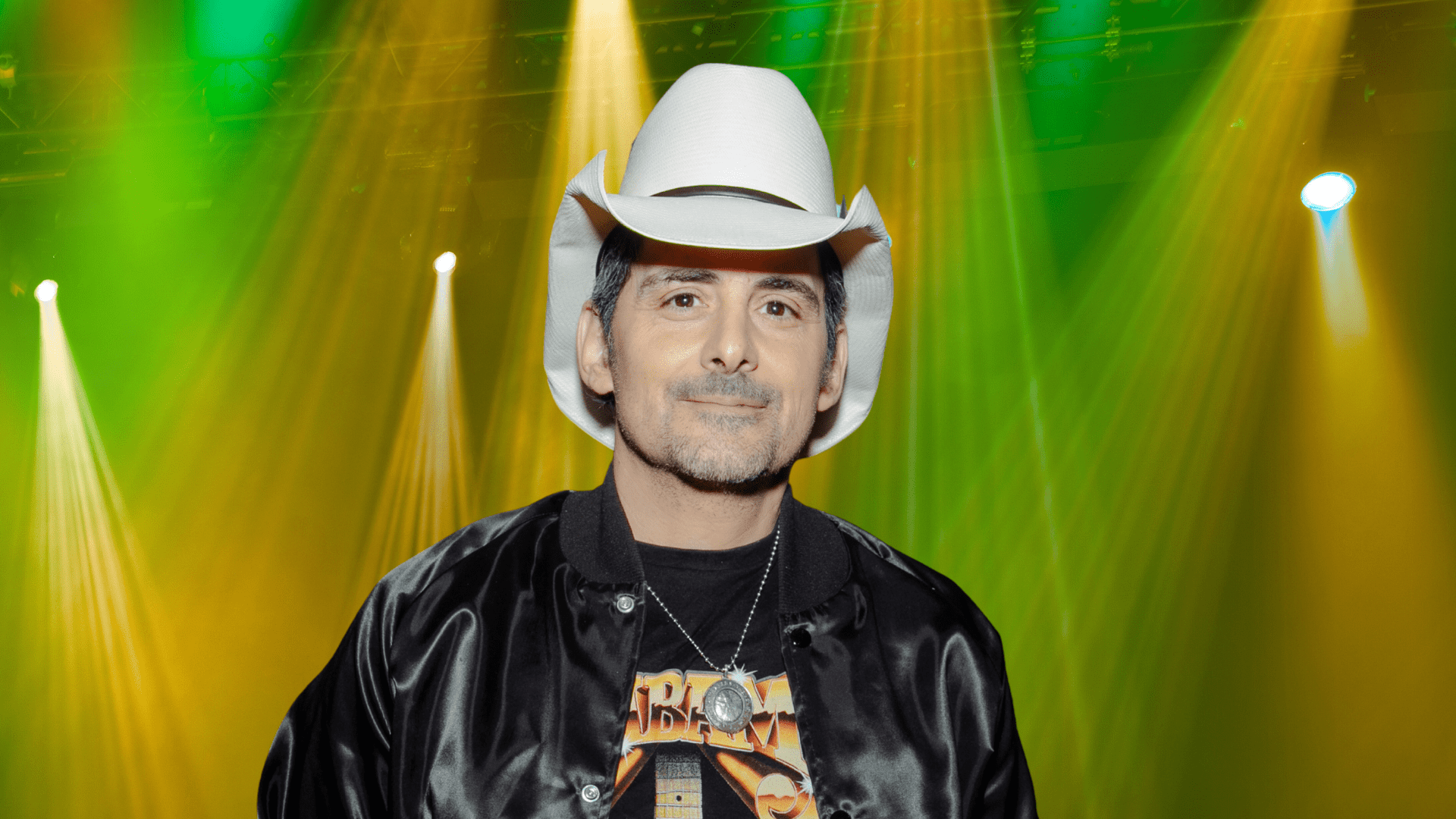 Brad Paisley posing in a white cowboy hat