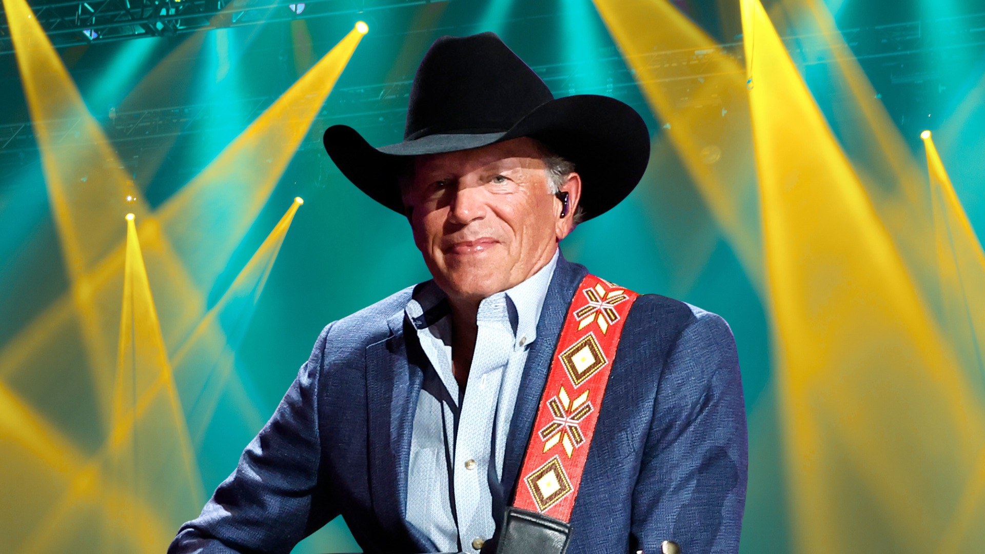George Strait posing on stage.