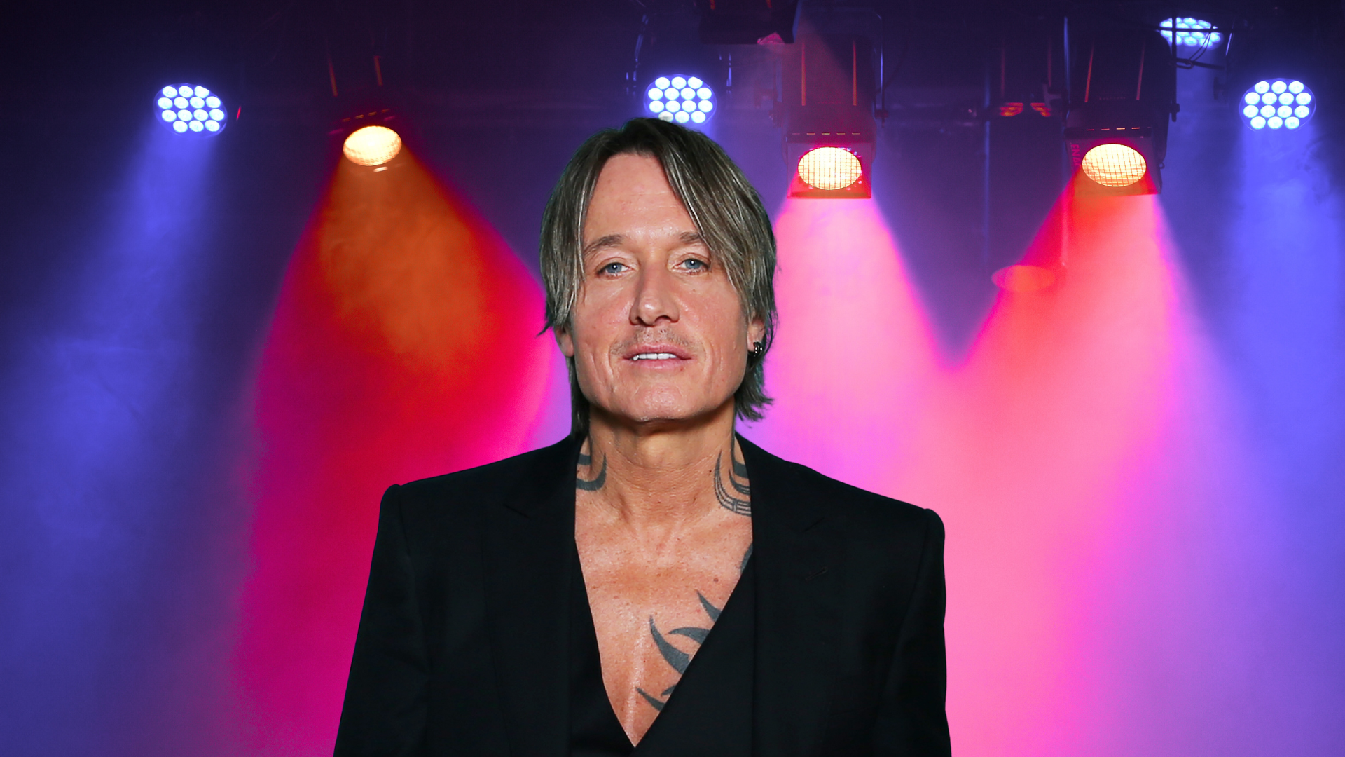 Keith Urban posing on a stage