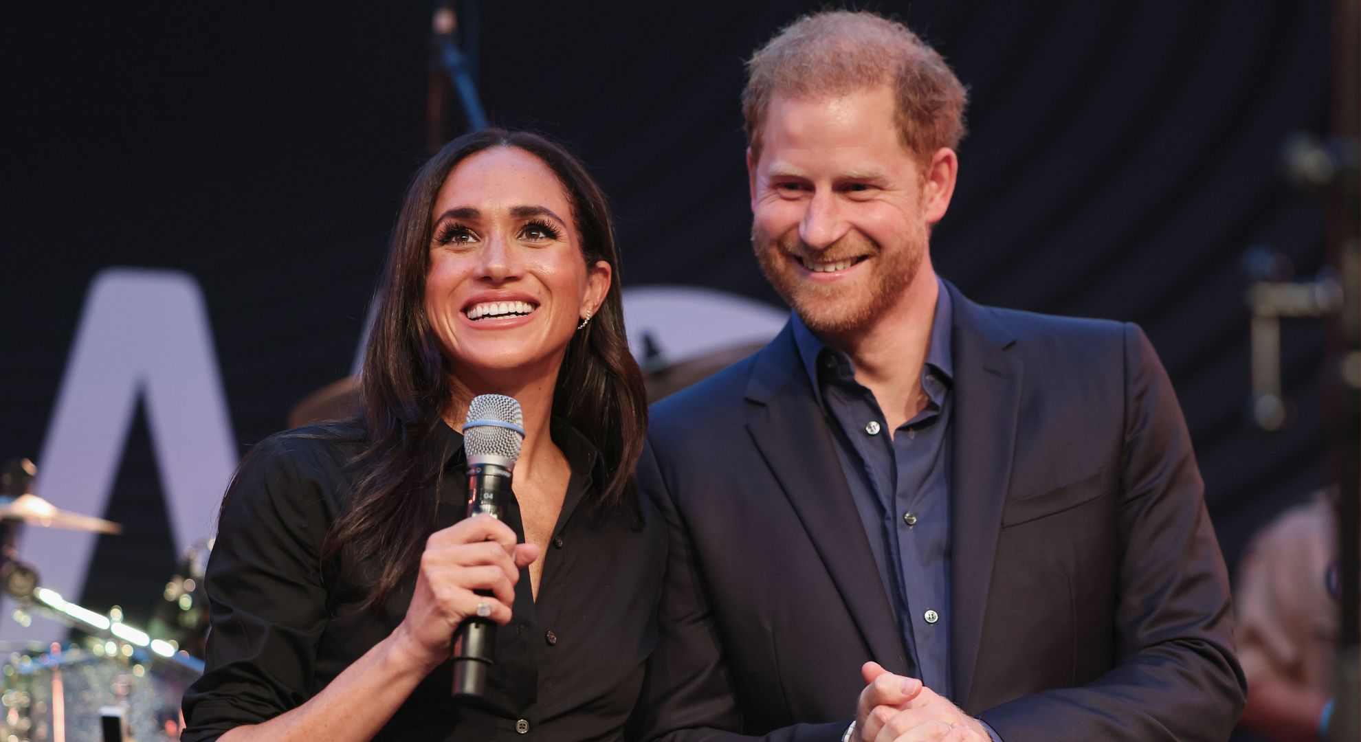 Prince Harry, Duke of Sussex and Meghan, Duchess of Sussex speak on stage at the "Friends @ Home Event" at the Station Airport during day three of the Invictus Games Düsseldorf 2023 on September 12, 2023 in Duesseldorf, Germany
