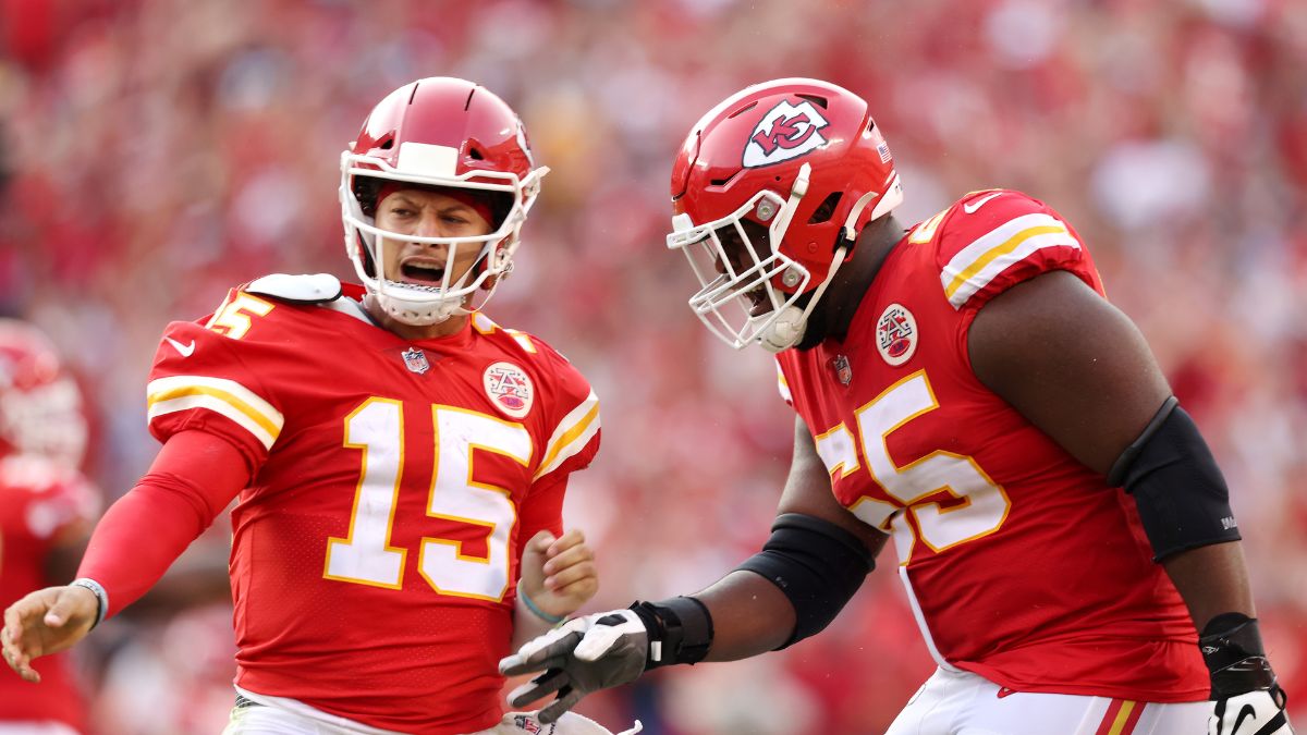 Patrick Mahomes #15 of the Kansas City Chiefs celebrates with Trey Smith #65 after throwing a touchdown pass during the fourth quarter at Arrowhead Stadium on September 12, 2021 in Kansas City, Missouri
