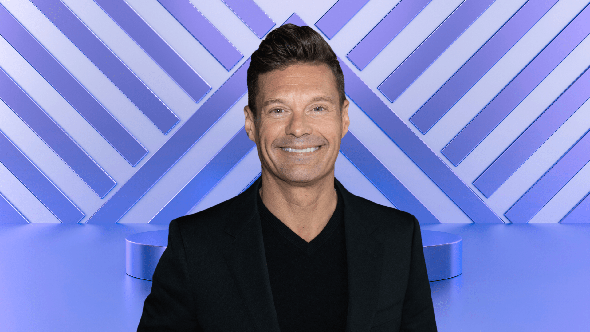Ryan Seacrest posing on a stage