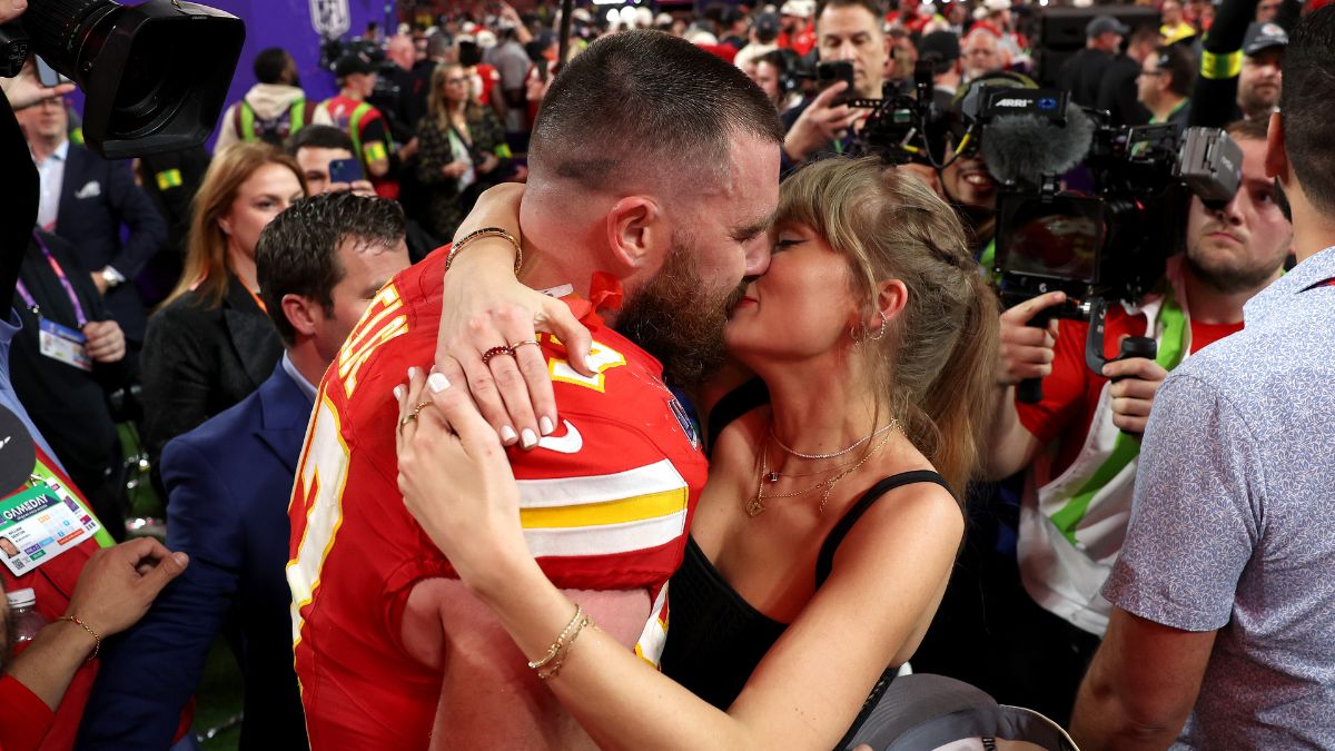 Travis Kelce #87 of the Kansas City Chiefs and Taylor Swift embrace after defeating the San Francisco 49ers in overtime during Super Bowl LVIII