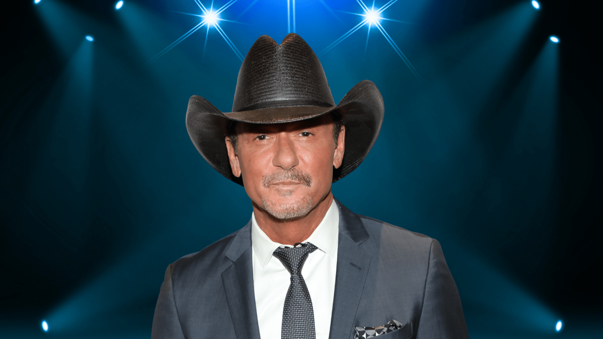 Tim McGraw posing in a cowboy hat.