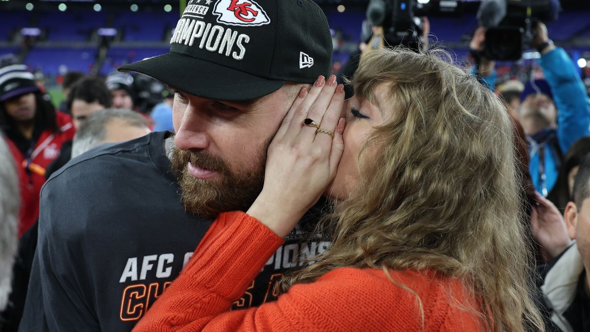 Travis Kelce #87 of the Kansas City Chiefs celebrates with Taylor Swift as she whispers in his ear after a 17-10 victory against the Baltimore Ravens in the AFC Championship Game at M&T Bank Stadium on January 28, 2024 in Baltimore, Maryland