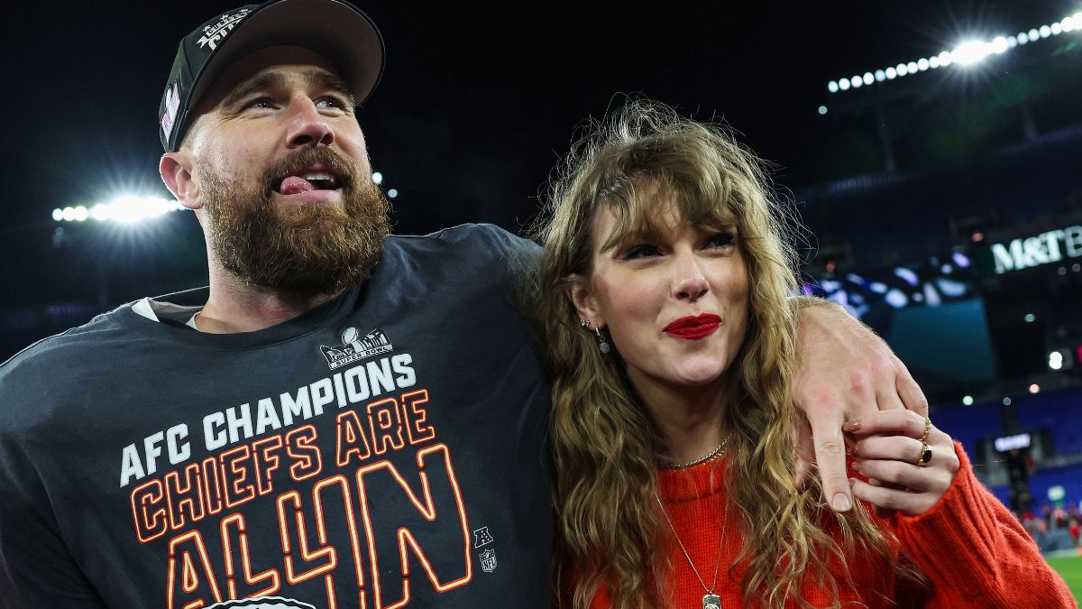 Travis Kelce #87 of the Kansas City Chiefs (L) celebrates with Taylor Swift after defeating the Baltimore Ravens in the AFC Championship Game