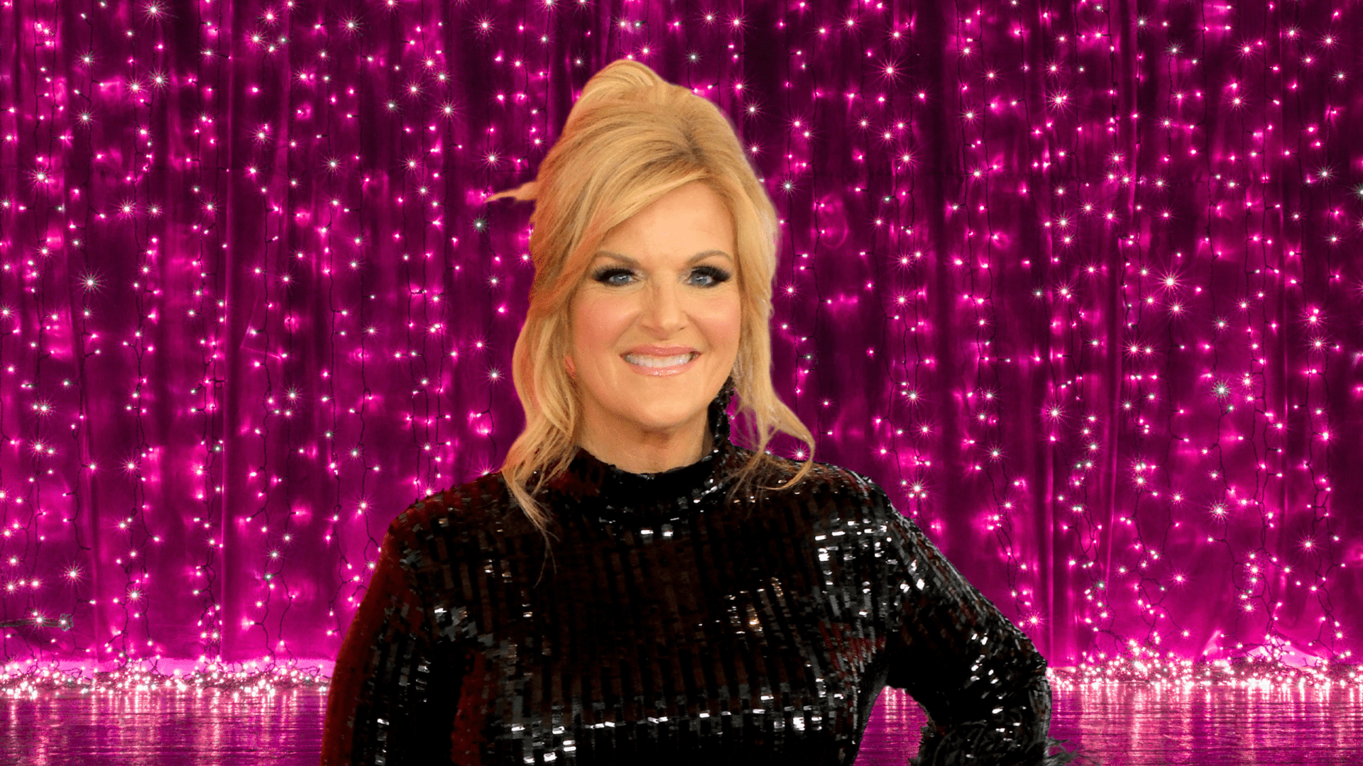 Trisha Yearwood posing on a colorful stage