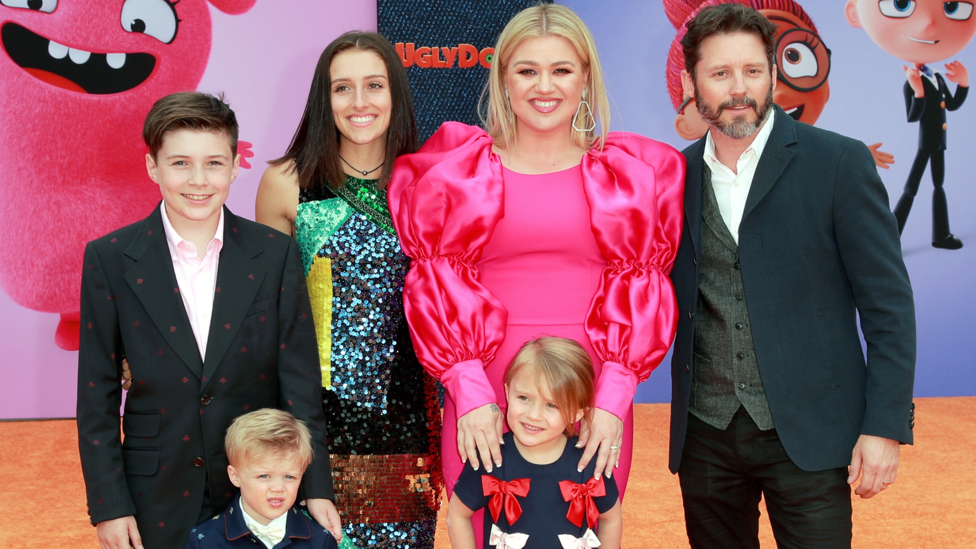 Brandon Blackstock poses with all of his children and then-wife Kelly Clarkson at an event