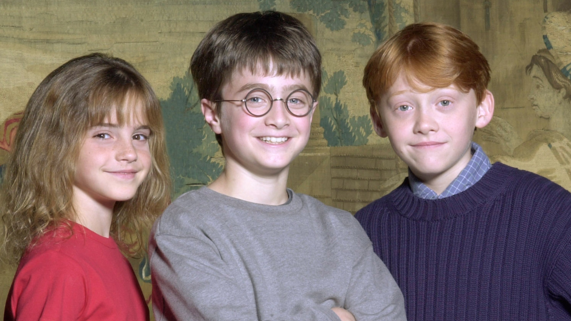 Emma Watson, Daniel Radcliffe and Rupert Grint smiling
