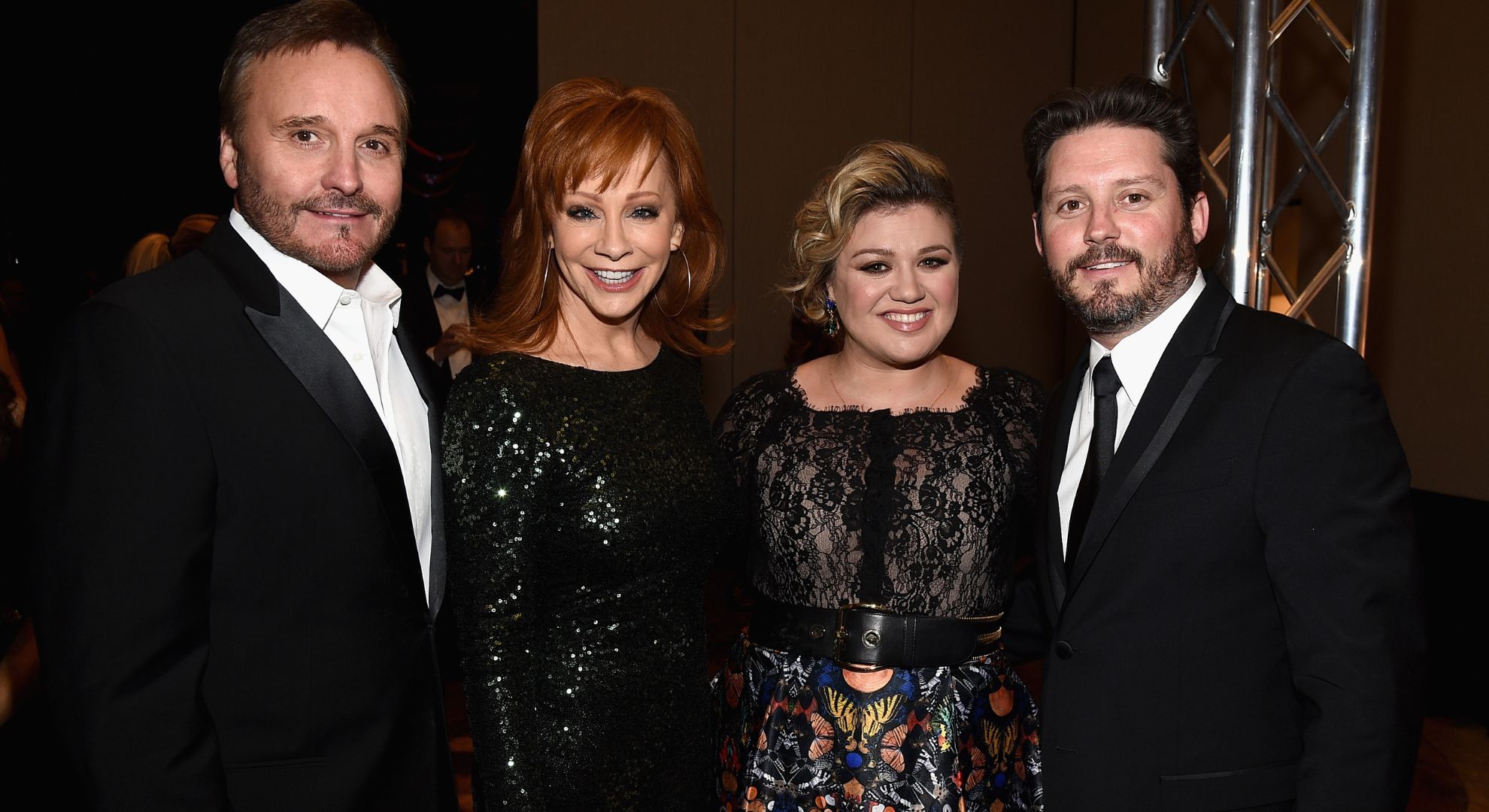 TV Producer Narvel Blackstock, singers Reba McEntire, Kelly Clarkson and Brandon Blackstock attend Muhammad Ali's Celebrity Fight Night XXI at the JW Marriott Phoenix Desert Ridge Resort & Spa on March 28, 2015 in Phoenix, Arizona