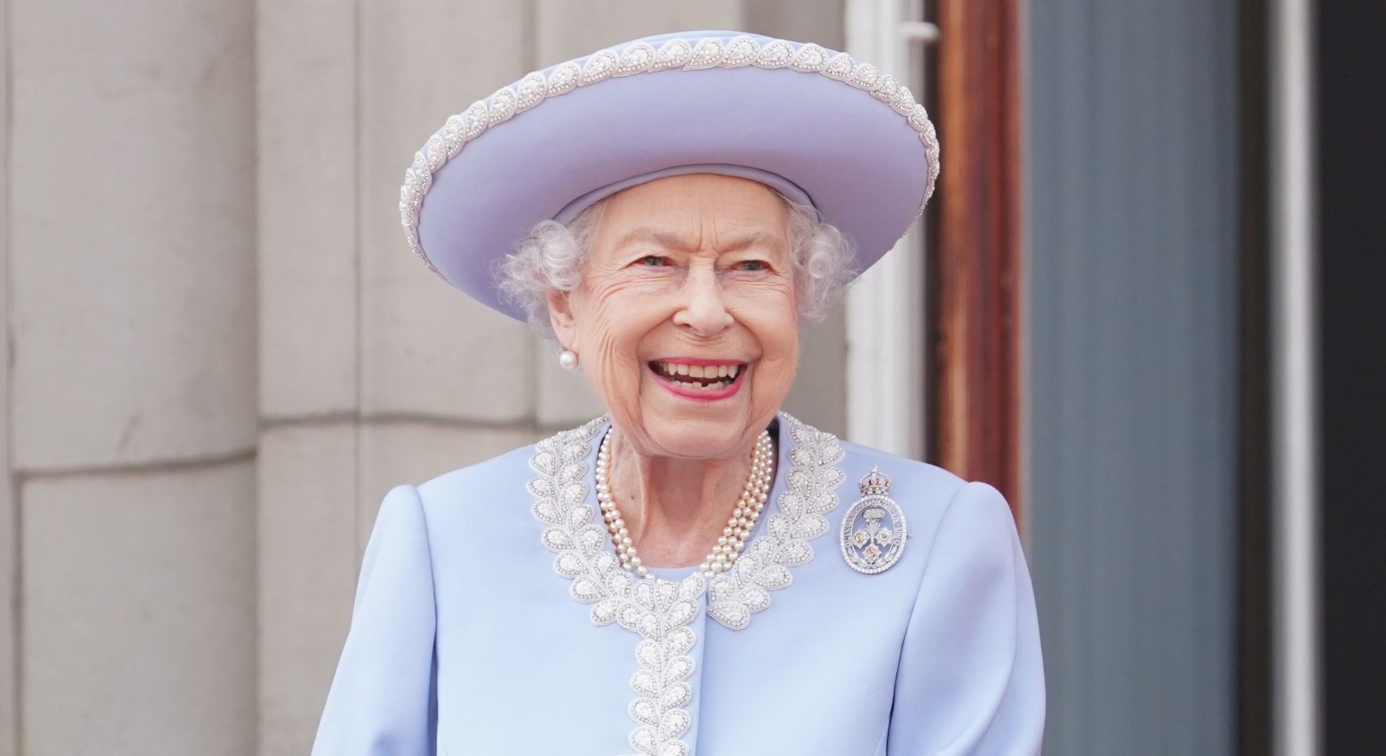 Queen Elizabeth II watches from the balcony of Buckingham Palace during the Trooping the Colour parade the Trooping the Colour parade on June 2, 2022 in London, England