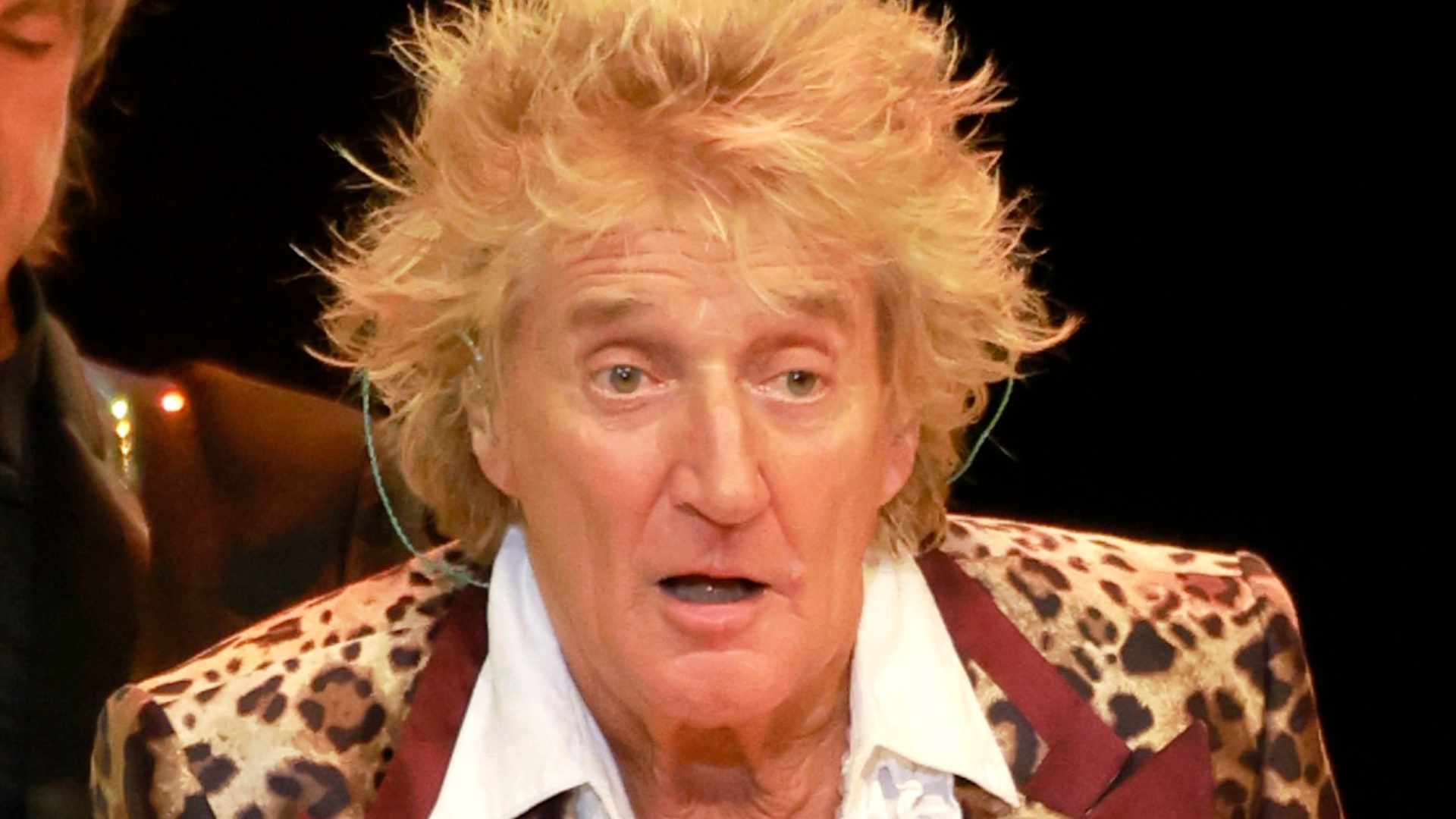 Rod Stewart performing onstage