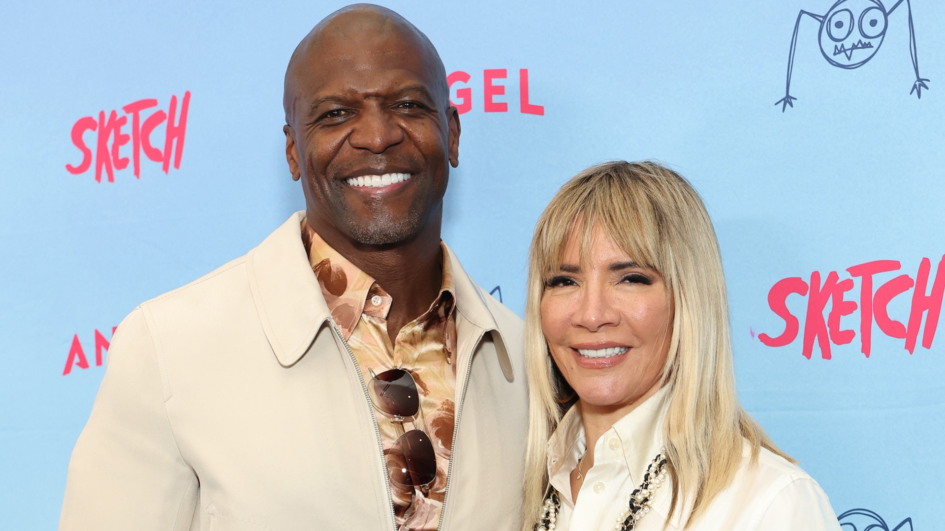 Terry Crews and Rebecca King-Crews smiling