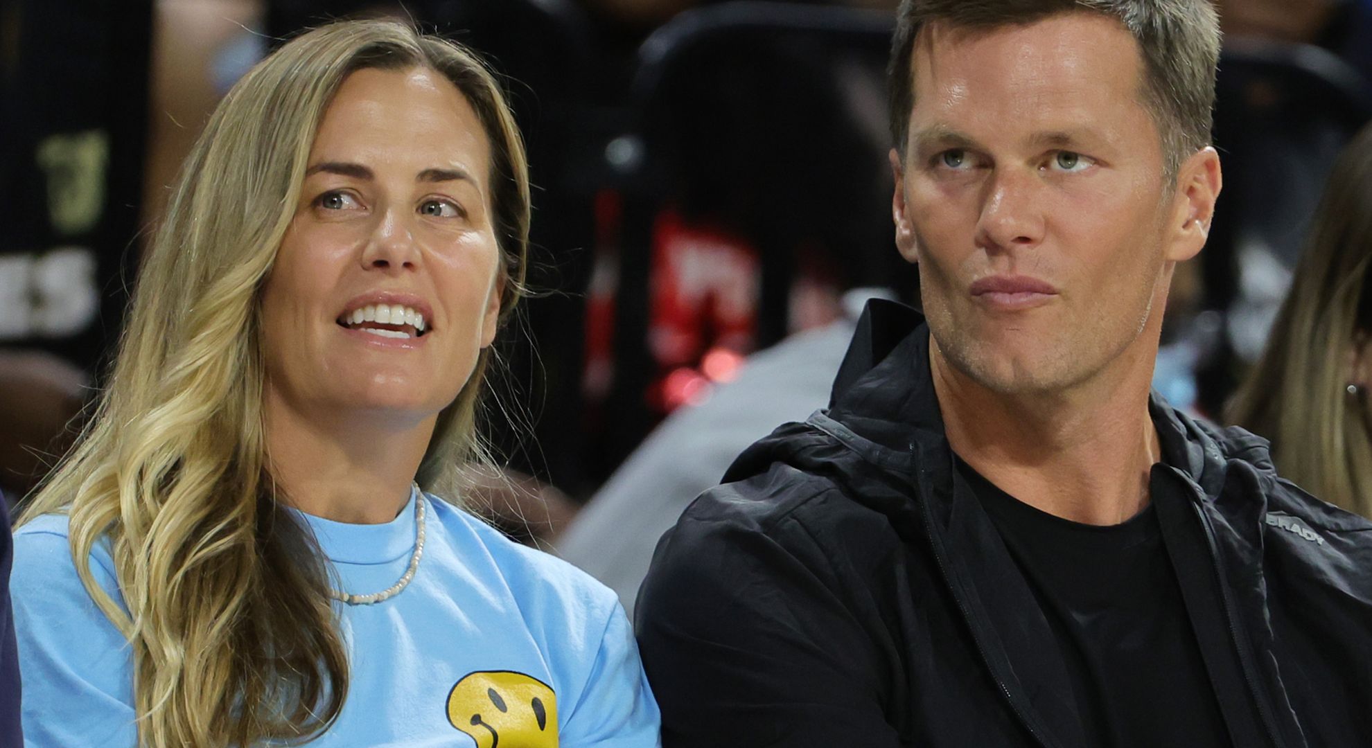 Julie Brady (L) and her brother, Tampa Bay Buccaneers quarterback Tom Brady, attend a game between the Connecticut Sun and the Las Vegas Aces at Michelob ULTRA Arena on May 31, 2022