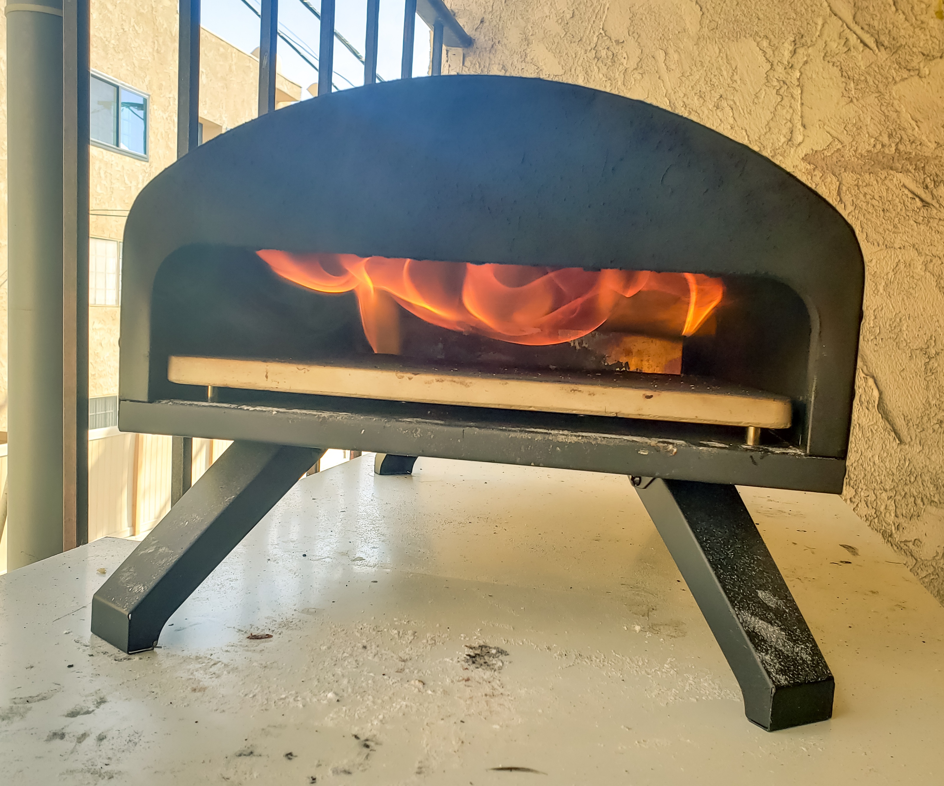 Wood fired pizza oven, roaring flames, bartello pizza oven