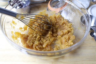 whisk in sugar, then egg