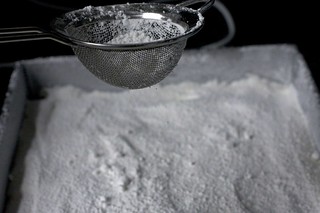 dusting the tops of the marshmallows