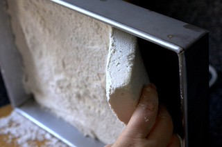 peeling the marshmallow from the pan