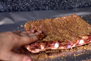 patting the spice rub on