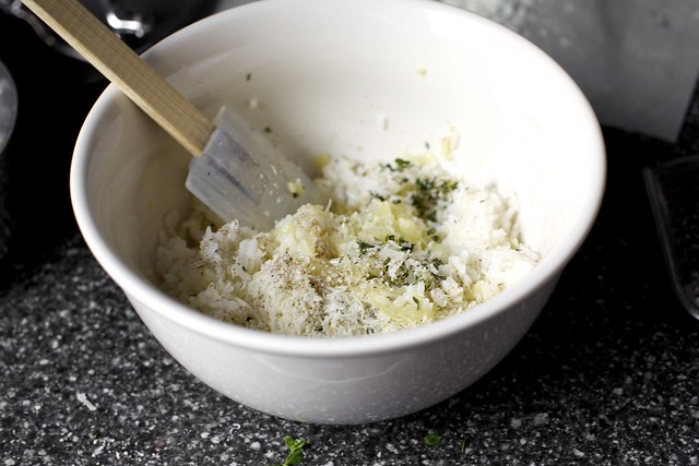 mixing rice, onions, herbs, parmesan