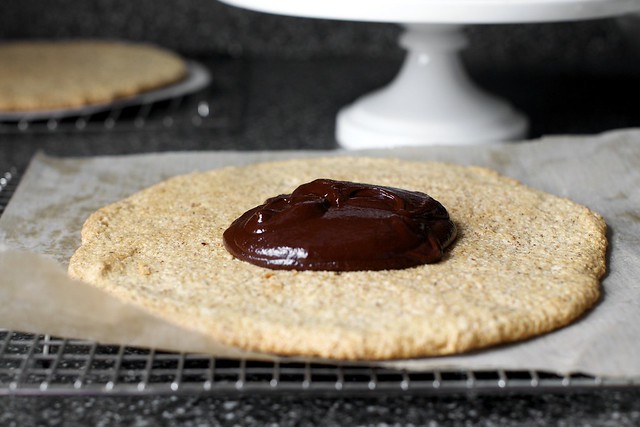 melted chocolate on each hazelnut macaroon