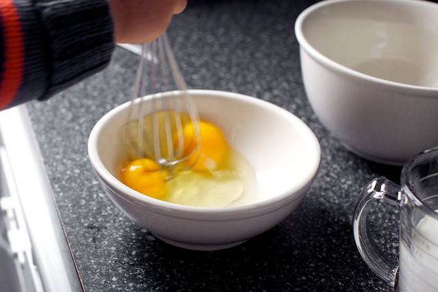 my helper whisks eggs