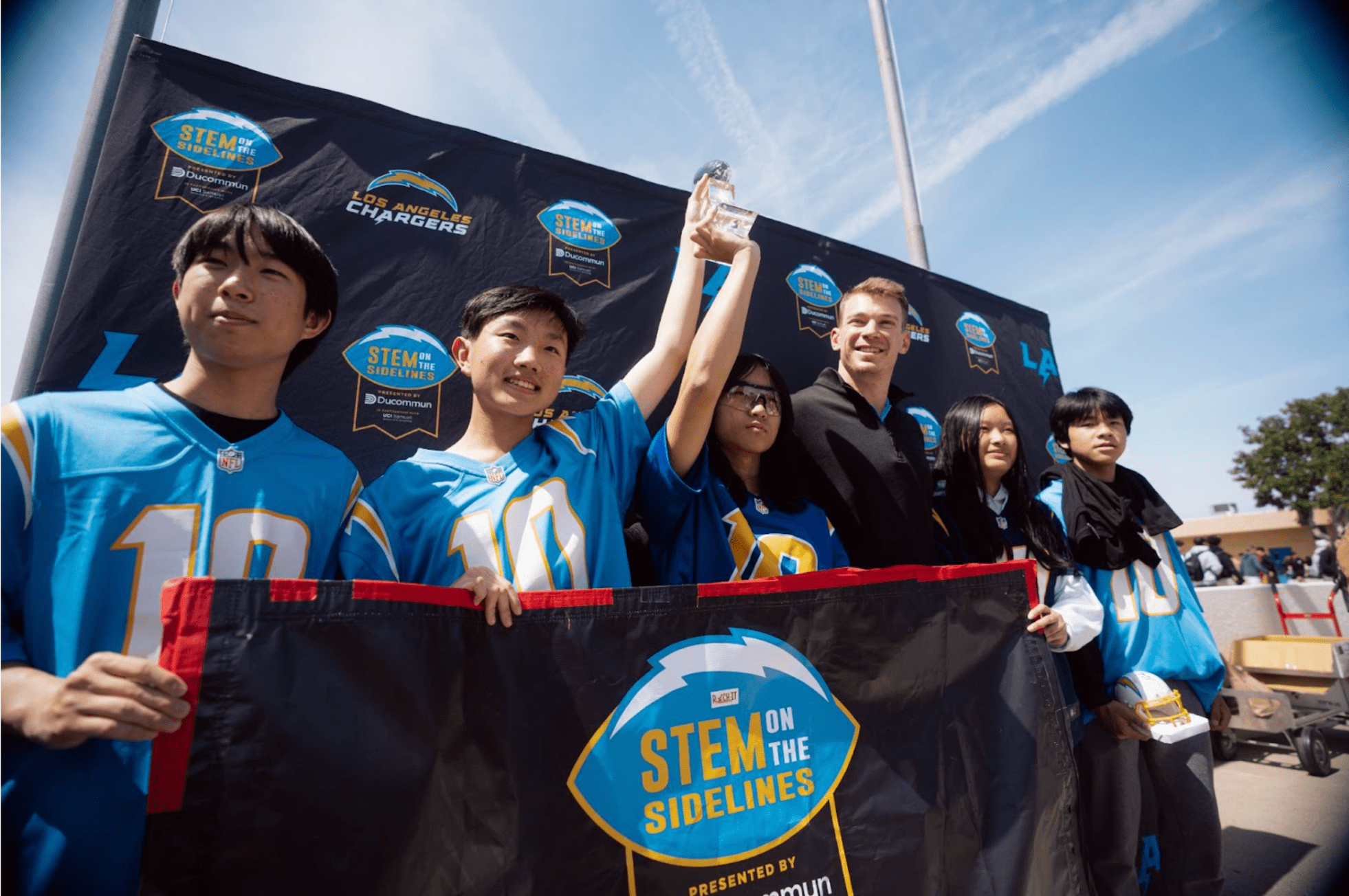 Los Angeles Chargers and Ducommun visit Fountain Valley High to celebrate Rock-It Robotics champions