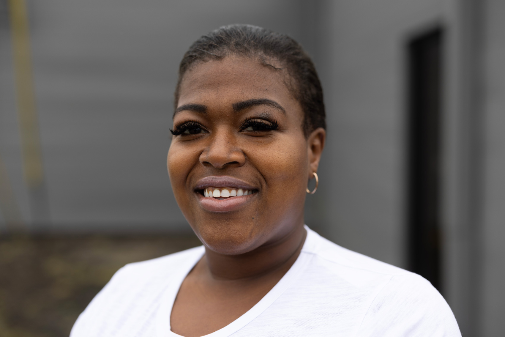 Ebony Sanco, council member, poses for a portrait outside of Arcola City Hall, Monday, April 8, 2024, in Arcola.