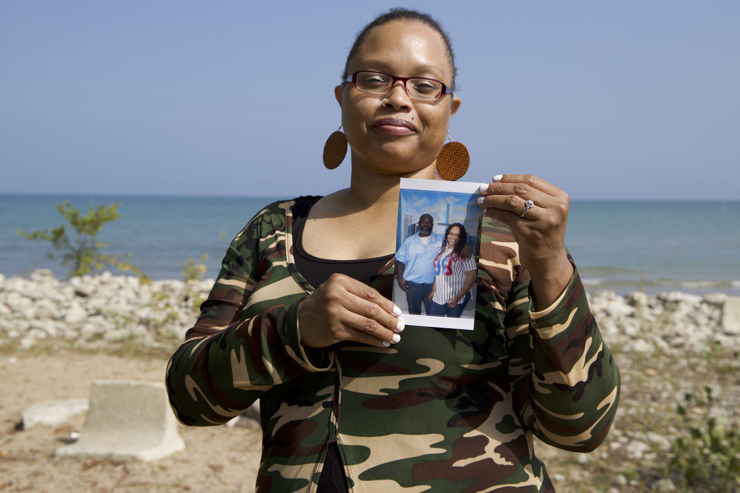 Tillie Lloyd holds a picture of herself and her fiance, Billy Johnson, who is deaf and working to get his GED while in prison. Lloyd says Johnson is being denied services. (Credit: Casey Toner/Illinois Answers Project)