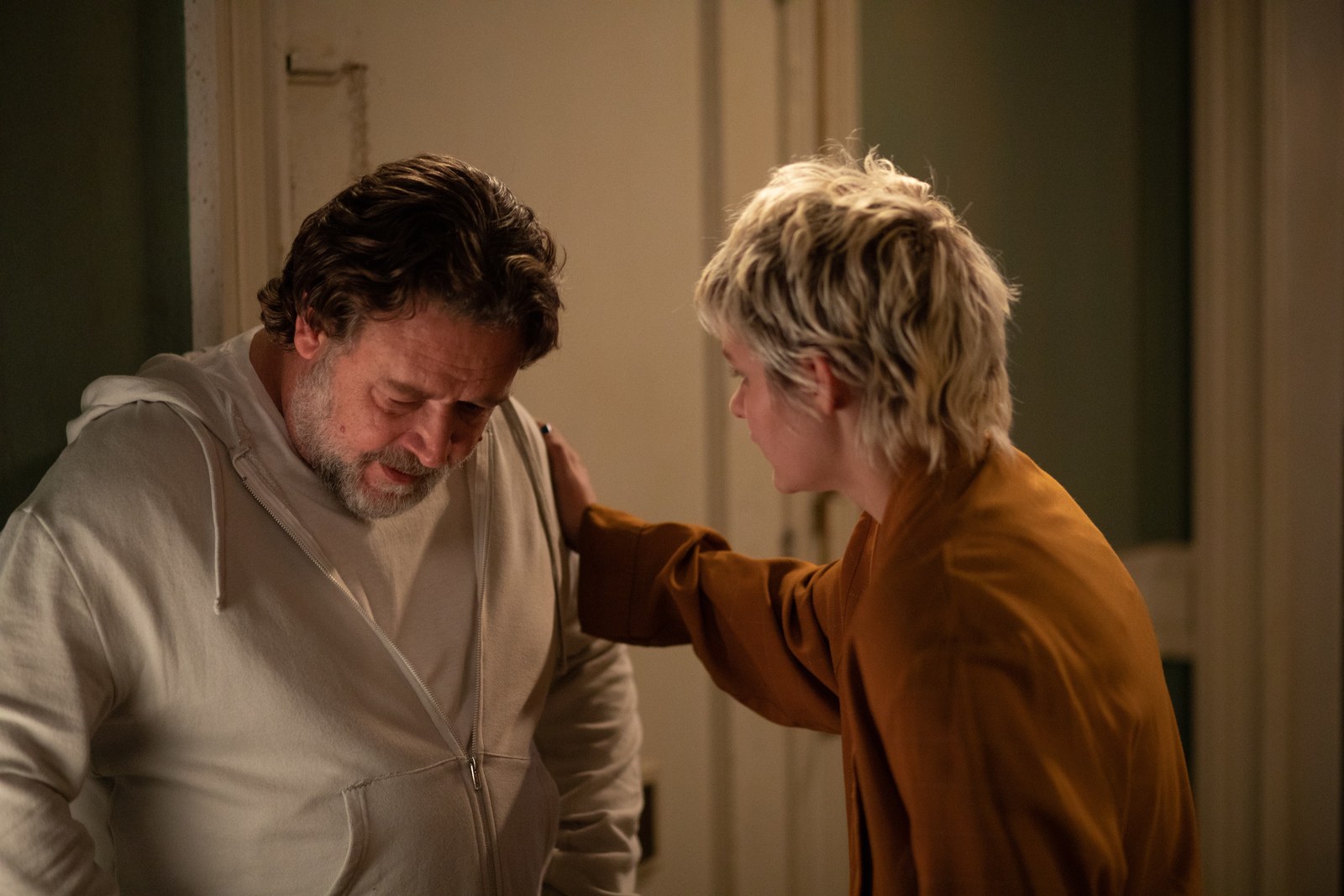 Russell Crowe, left, and Ryan Simpkins in a scene from the movie "The Exorcism."