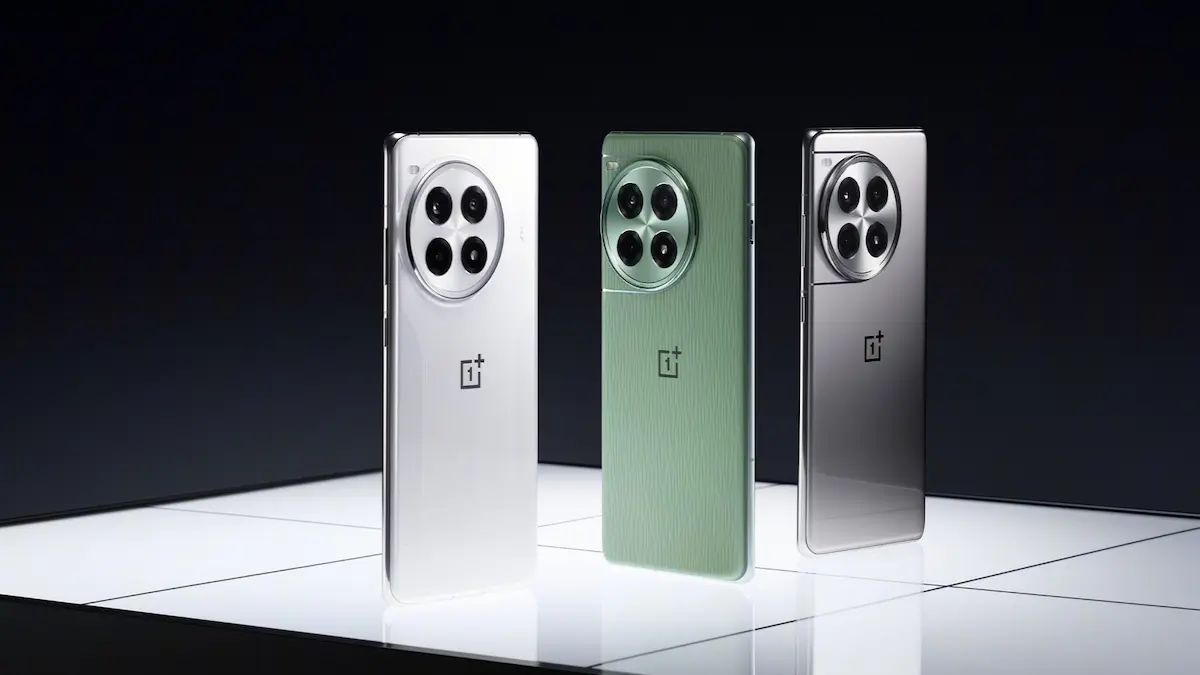Three color version of OnePlus's Ace3 Pro standing together: Ceramic White, Field Green, and Titanium Mirror Silver (from left to right)