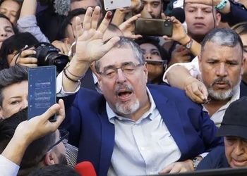 President-elect of Guatemala Bernardo Arévalo makes his way through a crowd of supporters.