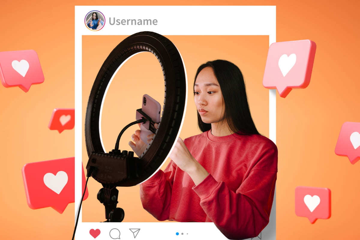 Instagram: como divulgar e-commerce Montagem de mulher gravando vídeo com celular e ring light dentro de quadro similar à post do Instagram e símbolos de like ao redor