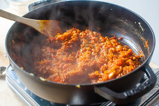 add tomatoes and paste