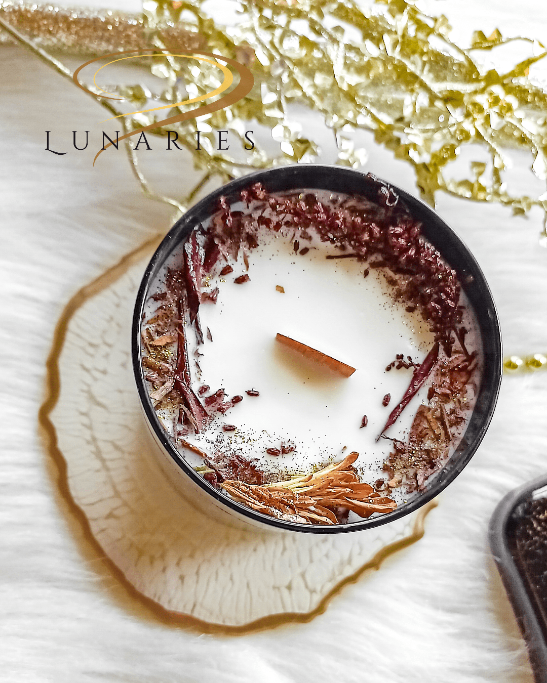 Exotic Sandalwood soy candle in a black glossy tumbler jar, featuring a wooden wick and decorated with brown dried flowers and botanicals