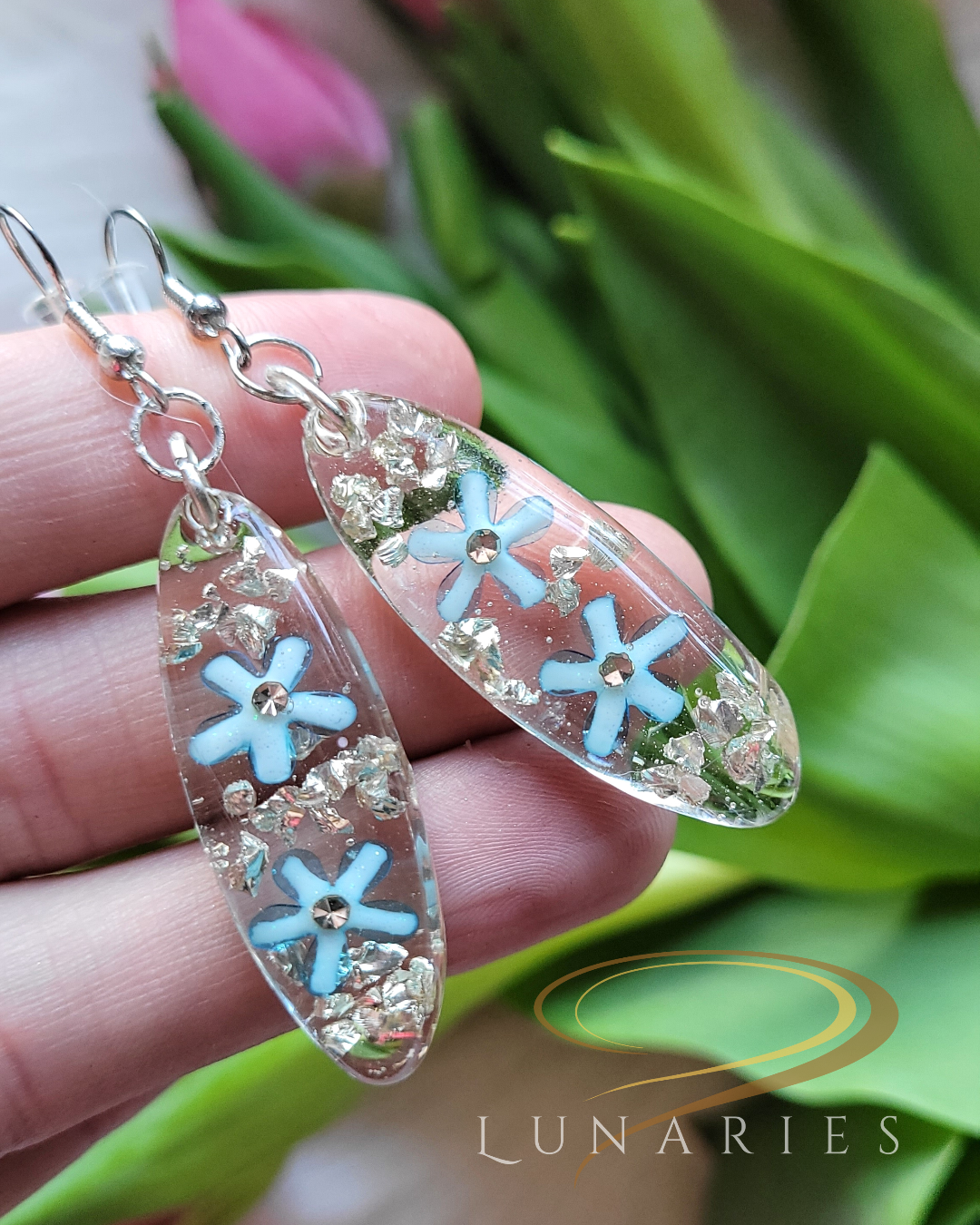 clear resin earrings with blue flowers and silver rhinestones