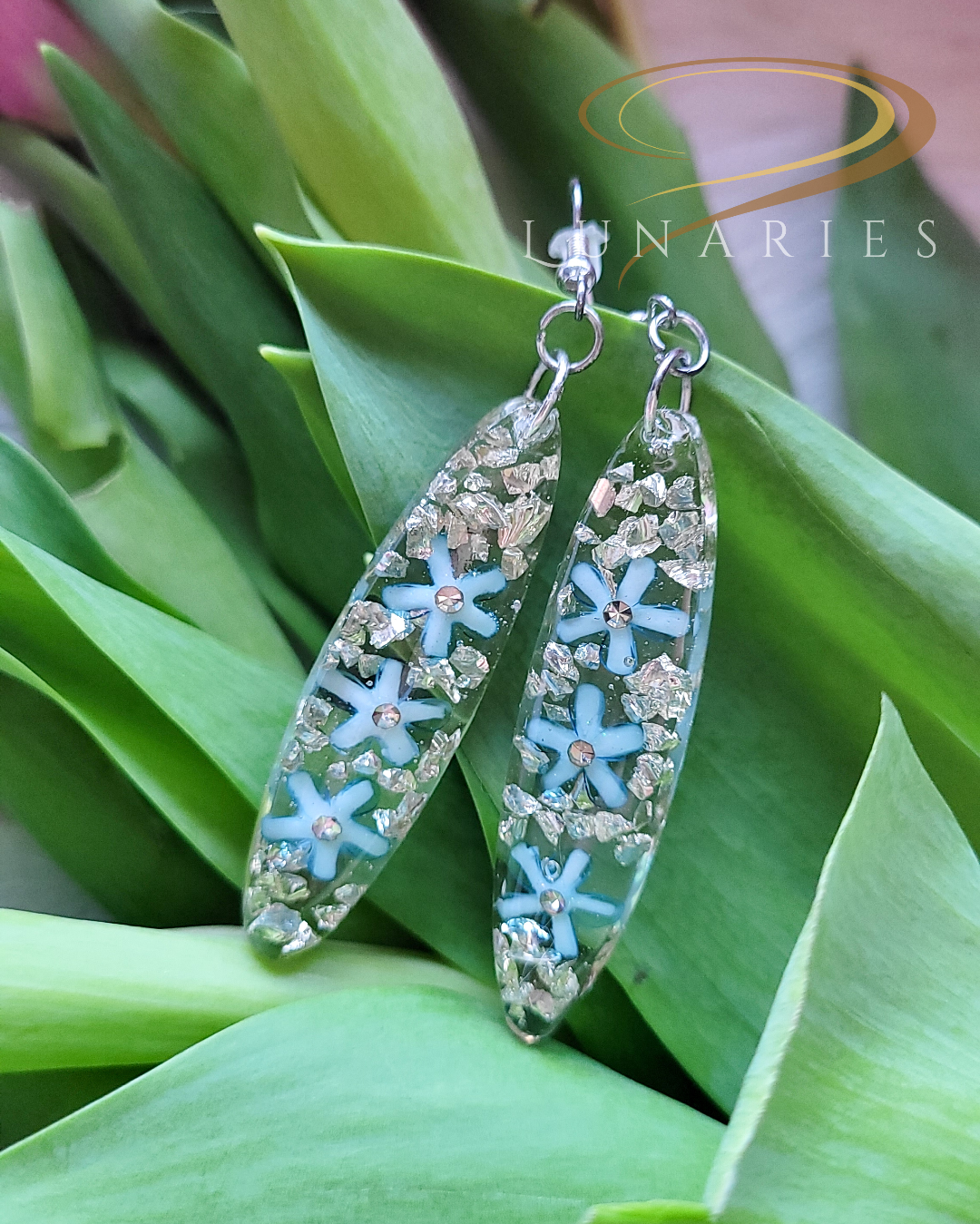 Oval Clear Resin Earrings with Blue Flowers - Image 2