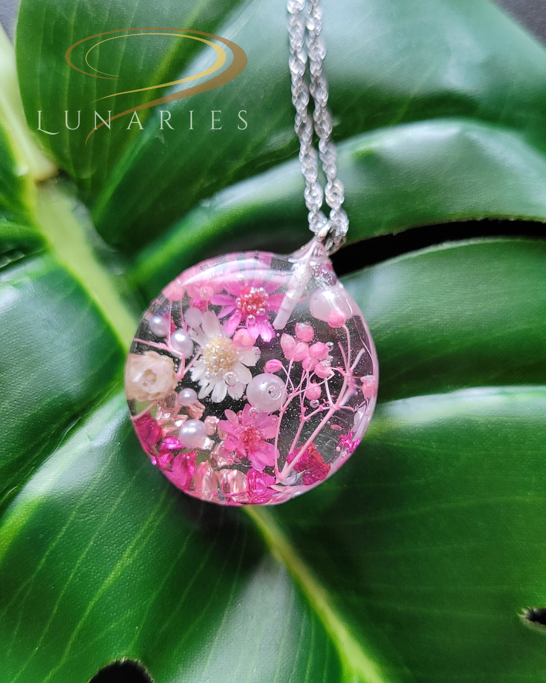 clear resin pendant with real pink dried flowers