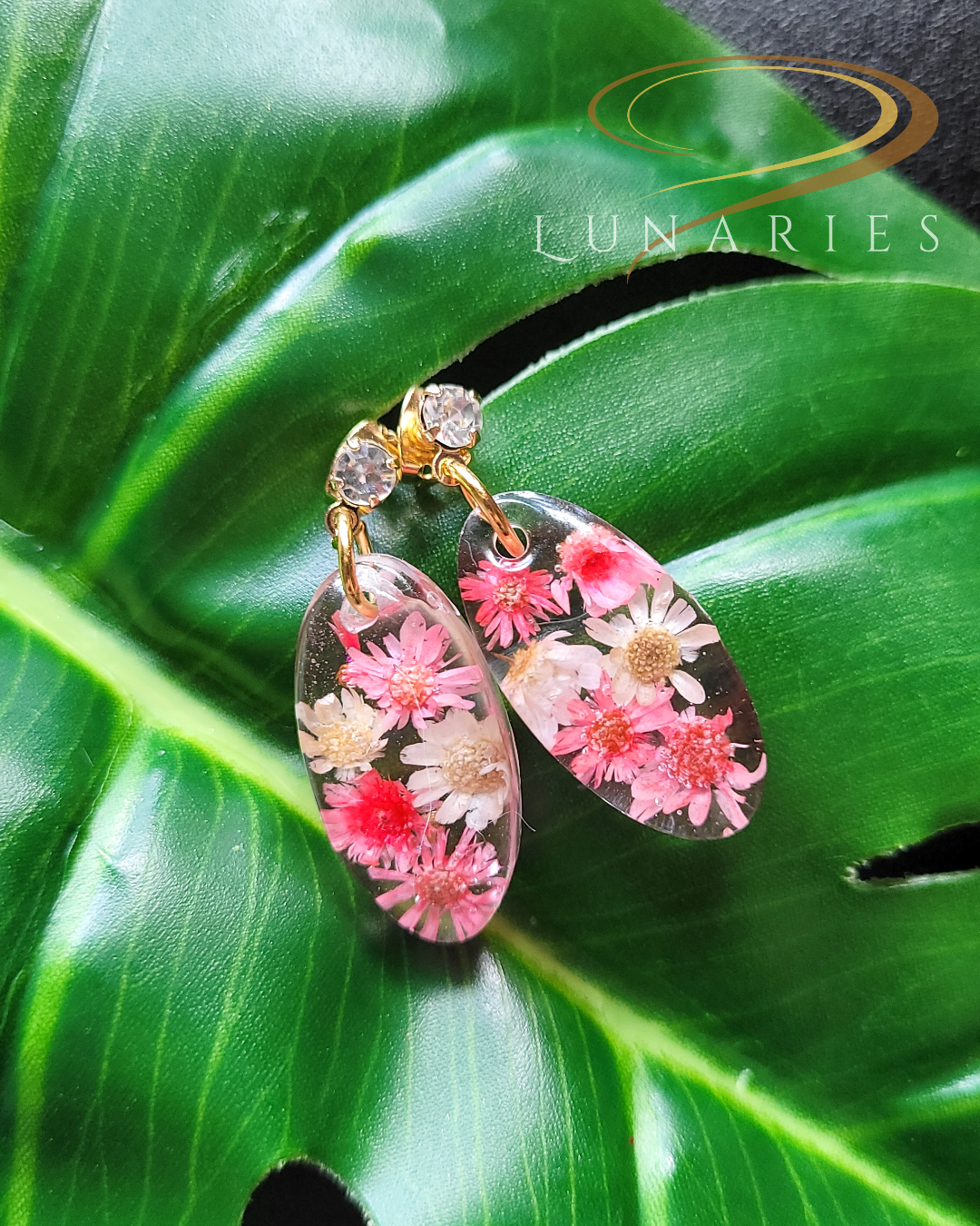 oval resin earrings with real pink and white dried flowers and sparkle cubic zirconia stud
