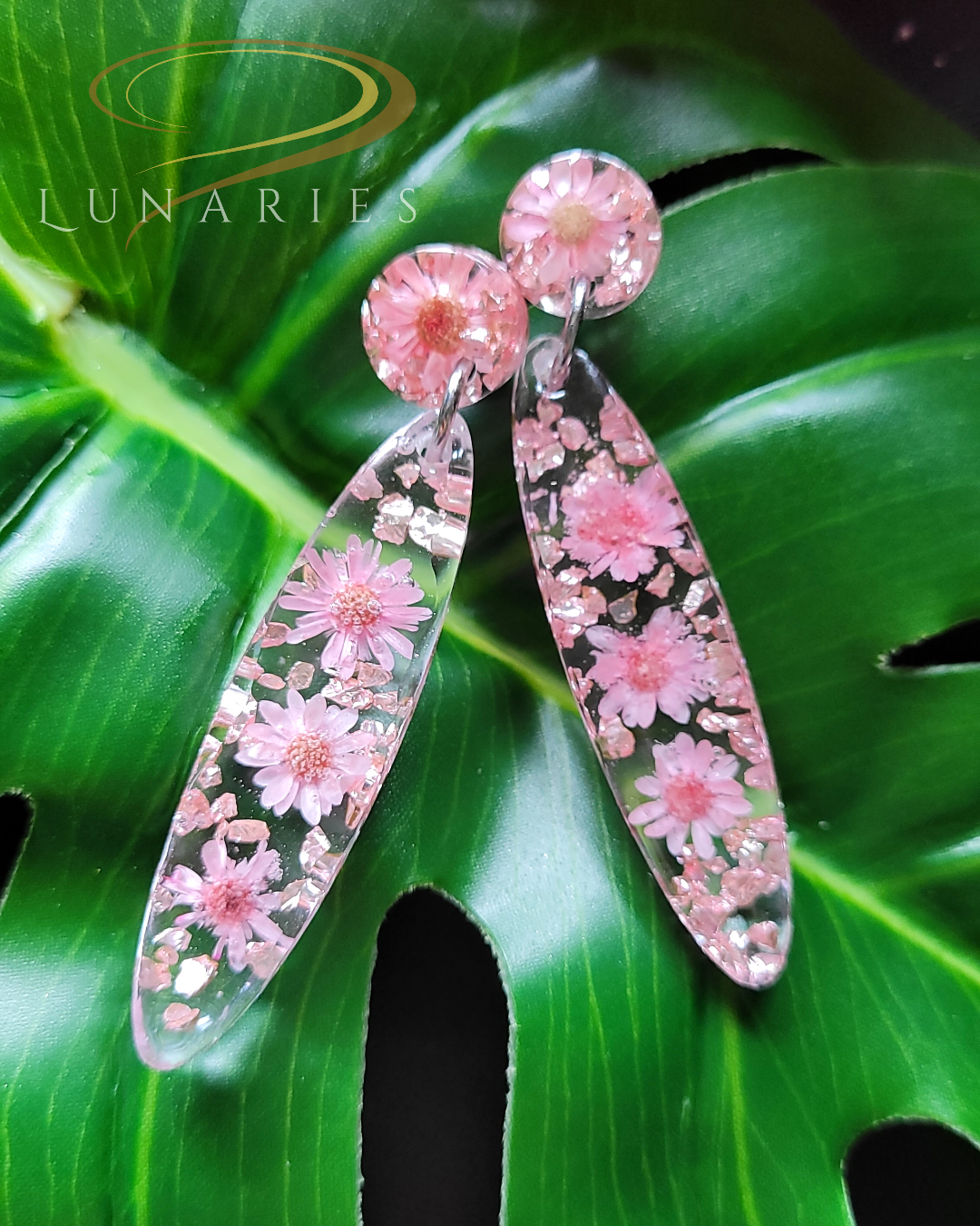 Oval resin earrings with real pink dried flowers finished with a stud