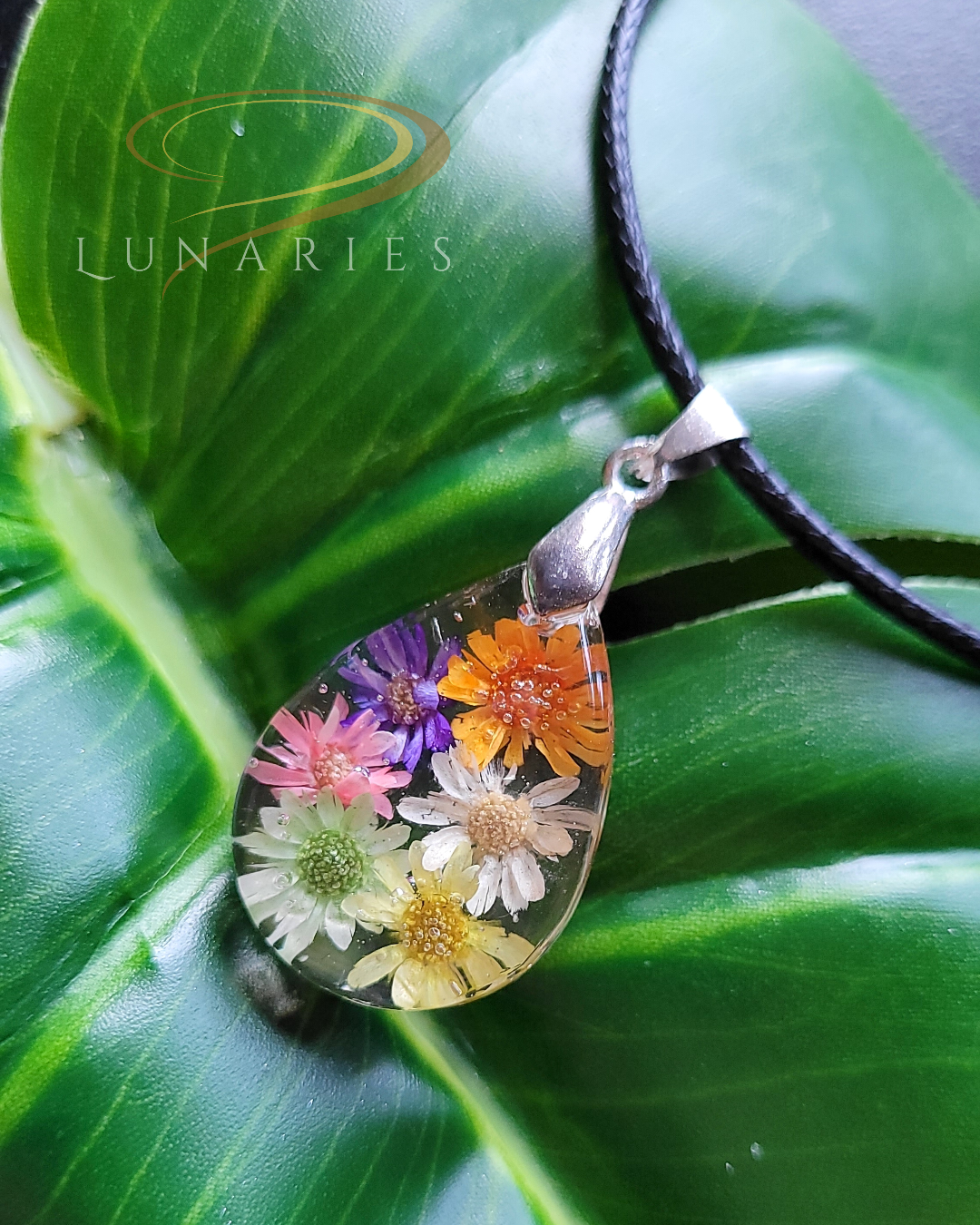 Clear resin teardrop pendant with real dried colorful flowers