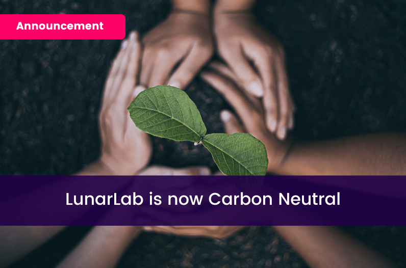 Hands planting a tree Text reads "Announcement: LunarLab is now Carbon Neutral"